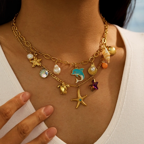 Collana in Acciaio Inossidabile Tema Oceano per Donna Placcata Oro Stella Marina Delfino Tartaruga Perla Artificiale Strass