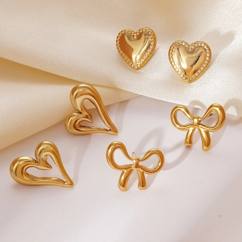 Boucles d'Oreilles Clous en Acier Inoxydable Or avec Nœud pour Femmes Étoile Cœur Papillon Feuille Bijoux Rétro Minimalistes