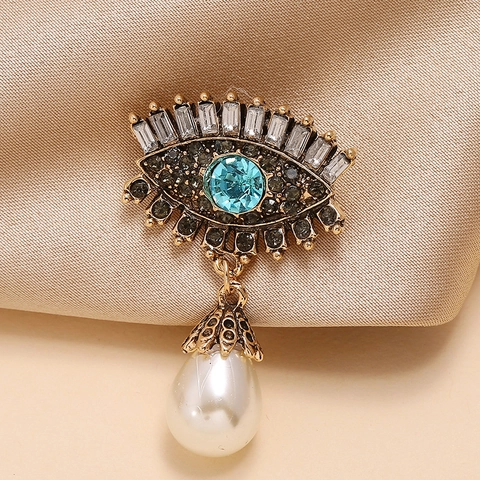 Spilla Malocchio Vintage in Lega con Strass Incrostati e Ciondolo a Goccia in Perla Artificiale Accessorio Moda Occidentale per Donna