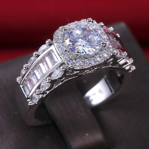 Elegant Brass Cubic Zirconia Engagement Ring For Women Featuring Round Main Stone With Halo And Baguette Side Stones Luxury Jewelry