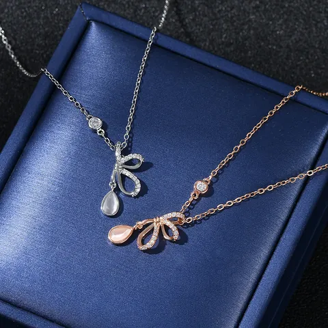 Elegant Copper Bowknot Pendant Necklace Real Gold Plated with Drop Shaped Cat Eye Stone Micro Pave Zirconia Jewelry for Women Gift