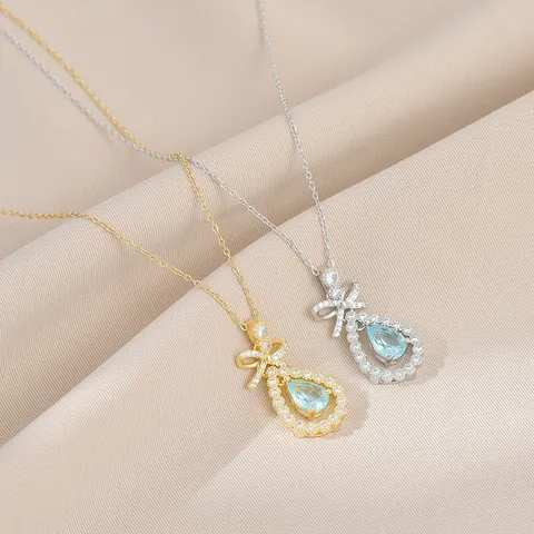 Collana con Ciondolo a Fiocco e Goccia in Rame con Zirconia Placcata in Oro Pietra Celeste Catena Clavicola Donna