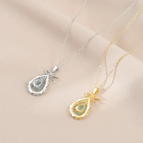 Collana con Ciondolo a Fiocco e Goccia in Rame con Zirconia Placcata in Oro Pietra Celeste Catena Clavicola Donna