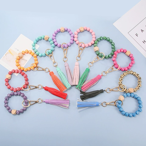 Llavero de Pulsera de Cuentas de Madera Floral Bohemio para Mujer Pulsera de Silicona con Colgante de Borla de Cuero PU Accesorios de Llavero