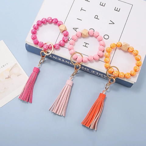 Llavero de Pulsera de Cuentas de Madera Floral Bohemio para Mujer Pulsera de Silicona con Colgante de Borla de Cuero PU Accesorios de Llavero
