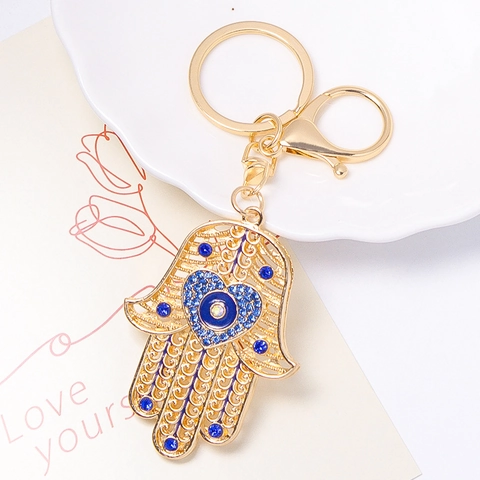 Llavero Mano de Hamsa Mal de Ojo Chapado en Oro Aleación de Zinc Strass Corazón Hueco Colgante Protección Para Mujer Accesorio Bolso Regalo