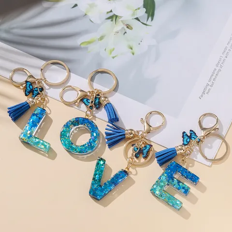 Portachiavi Con Lettera Iniziale Dolce Ciondolo a Farfalla in Resina Glitterata E Nappina Elegante Portachiavi Alfabeto Blu Rosa per Borsa Donna Regalo