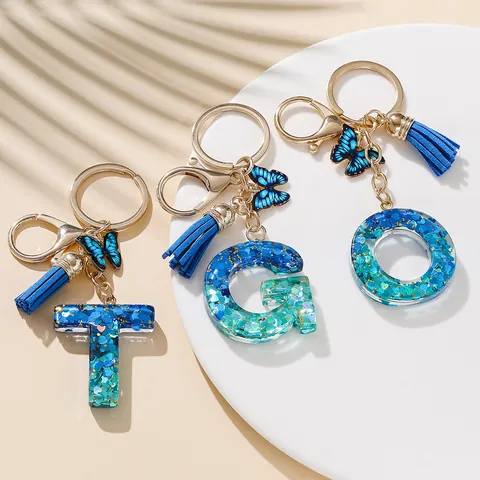 Portachiavi Con Lettera Iniziale Dolce Ciondolo a Farfalla in Resina Glitterata E Nappina Elegante Portachiavi Alfabeto Blu Rosa per Borsa Donna Regalo