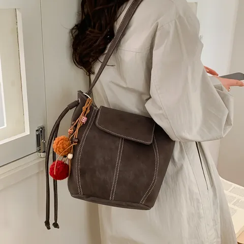 Women Retro Suede Synthetic Leather Bucket Bag With White Stitching And Colorful Pom-Pom Pendant Large Capacity Shoulder Bag