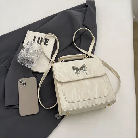 Damen Fashion PU Leder Rucksack Faltenstruktur Metall Schmetterling Schnalle Mehrzweck Schultertasche Umhängetasche Handtasche Street Style Täglich Reise Geldbörse
