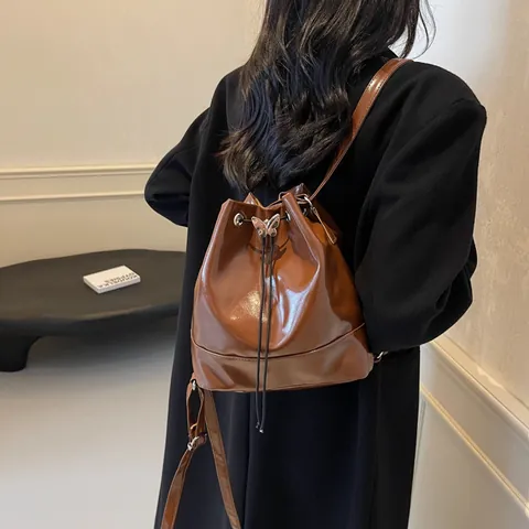 Women Fashion PU Leather Butterfly Buckle Drawstring Bucket Bag Versatile Shoulder Bag Backpack Commuting Handbag Girls