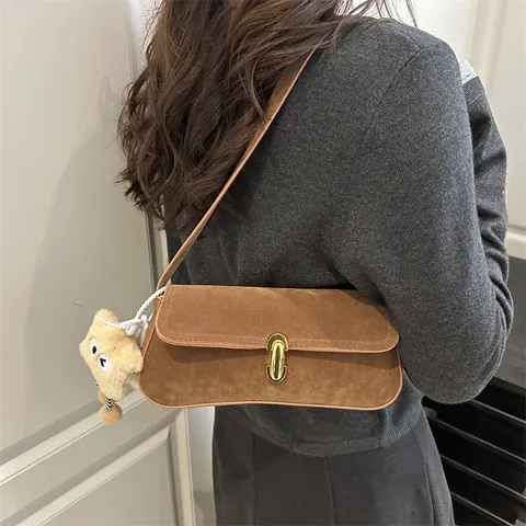 Women's Vintage Suede Underarm Bag Retro Solid Color Baguette Bag With Metal Lock And Funny Plush Monster Pendant Shoulder Handbag