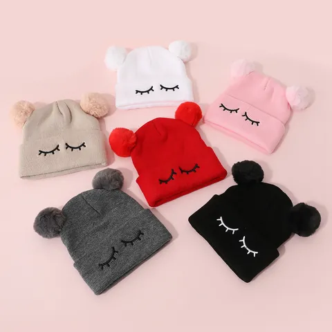 Kids Cute Eyelash Embroidery Knitted Beanie Hat With Double Faux Fur Pom Poms Winter Warm Acrylic Crochet Skull Cap
