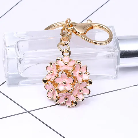 Porte-clés Femme Style Coréen Alliage de Zinc Émail Marguerite Boule de Fleurs Or Ajouré Pendentif de Sac Bijoux Cadeau