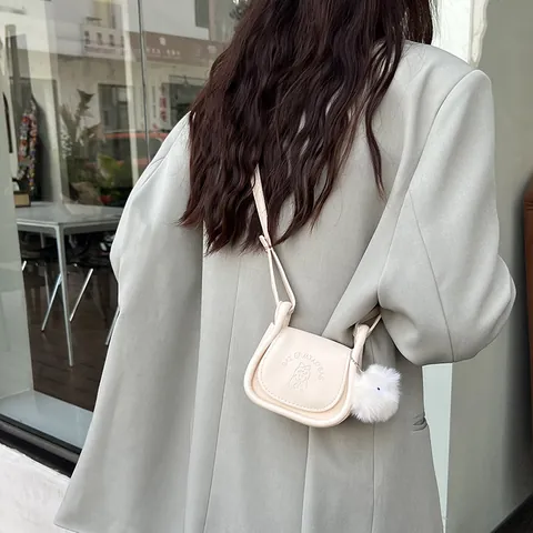 Women Retro PU Leather Saddle Crossbody Bag With Pom Pom Charm Cartoon Girl Embossed Mini Shoulder Bag Casual Handbag