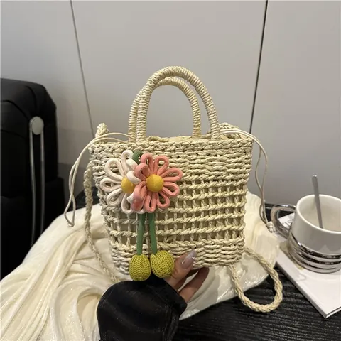 Handmade Straw Woven Bucket Bag For Women Summer Beach Vacation Hollow Mesh Handbag With Knit Flower Pendant Drawstring