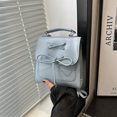 Damen Mode PU Leder Kleiner Rucksack Schleife Überkreuzte Riemen Handtasche Koreanischer Stil Casual Schultertasche Mini Büchertasche