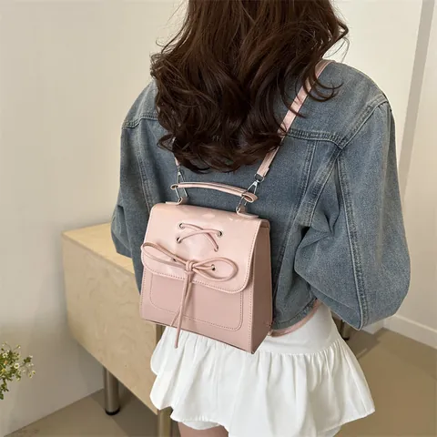 Damen Mode PU Leder Kleiner Rucksack Schleife Überkreuzte Riemen Handtasche Koreanischer Stil Casual Schultertasche Mini Büchertasche