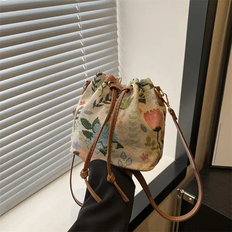 Women's Retro Ethnic Woven Bucket Bag Boho Geometric Floral Drawstring Crossbody Bag Jacquard PU Leather Travel Handbag