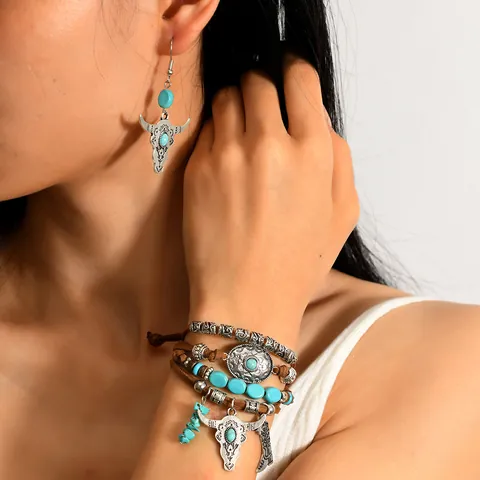 Set di Gioielli Vintage Bohemien Donna Lega Argento Antico Testa di Toro Stivali Turchese Bracciale Intrecciato in Pelle Orecchini