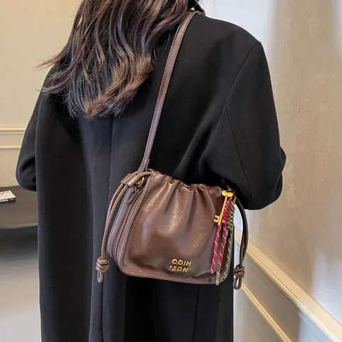 Women's Retro PU Leather Bucket Bag Drawstring Pleated Shoulder Bag Casual Crossbody Bag With Braided Rope Charm