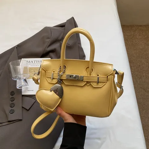 Women PU Leather Kelly Style Handbag With Heart Charm Fashion Lock Closure Crossbody Bag Adjustable Strap Urban Top Handle Bag For Office Dating