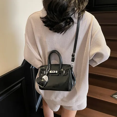 Women PU Leather Kelly Style Handbag With Heart Charm Fashion Lock Closure Crossbody Bag Adjustable Strap Urban Top Handle Bag For Office Dating