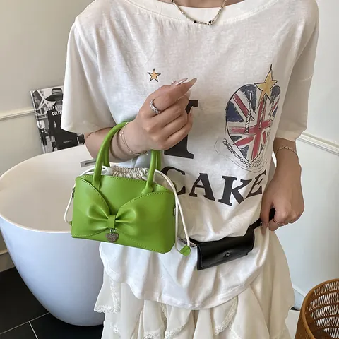 Borsa a Secchiello in Pelle PU di Nicchia da Donna Borsa a Tracolla con Fiocco Grande Interno Coulisse Pendaglio Cuore Borsa Crossbody