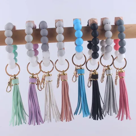 Silikonperlen Schlüsselanhänger Armband Boho Buchenholz Achteckige Perle Kunstleder Quaste Handgelenk Schlüsselanhänger Für Damen Tasche Anhänger