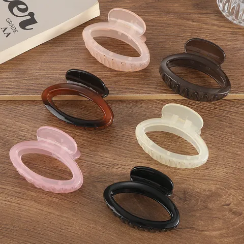 Elegant Plastic Resin Hollow Oval Hair Claw For Women Jelly Color Medium Shark Clip Simple Fashion Hair Accessories Daily Headwear