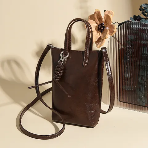 2025 Nuevo Bolso de Bandolera Minimalista para Mujer Cuero de PU Mini Bolso de Mano para Teléfono Móvil Color Sólido Con Nudo Trenzado