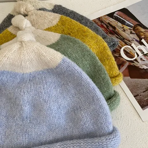 Women Contrast Color Knitted Beanie Hat Soft Acrylic Winter Warm Skull Cap With Knotted Top And Rolled Edge Cute Headwear
