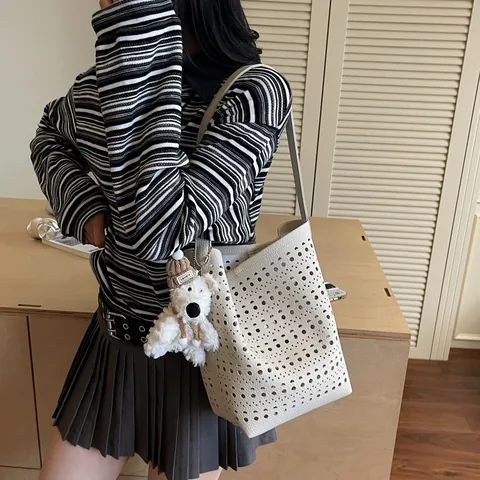 Women Laser Cut Hollow Out Bucket Bag With Plush Pendant PU Leather Single Shoulder Crossbody Handbag Niche Fashion Tote Bag