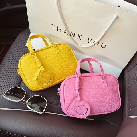 Koreanischer Stil Minimalistische PU Kieselstruktur Umhängetasche Für Damen Sommer Neue Kleine Quadratische Handtasche Handytasche Mit Smile-Anhänger