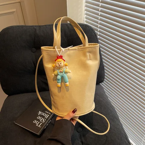 Women's PU Leather Bucket Bag Minimalist Solid Color Crossbody Shoulder Bag With Cartoon Doll Pendant Pearl Chain Summer Small Handbag