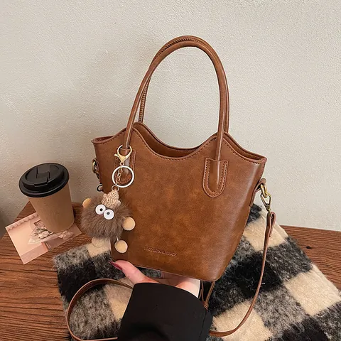Women Vintage PU Leather Bucket Bag Minimalist Solid Color Wavy Edge Shoulder Crossbody Handbag With Plush Charm For Daily Use