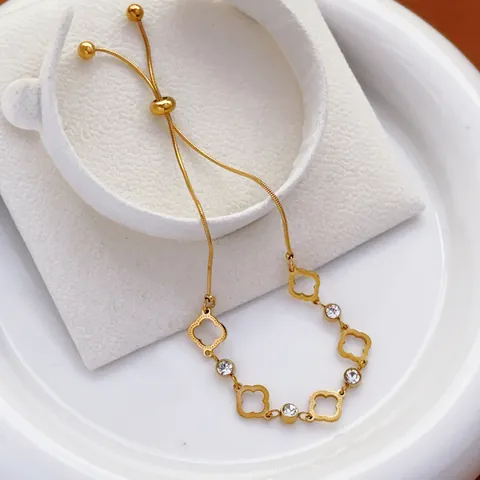 Women Fashion Titanium Steel Hollow Four Leaf Clover Bracelet Gold Plated Zirconia Adjustable Drawstring Chain Bracelet Elegant Jewelry Gift