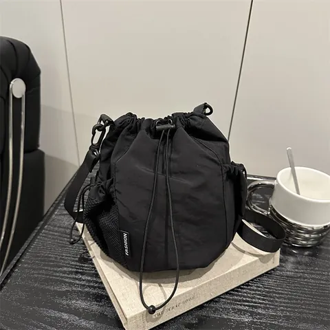 Women Casual Nylon Drawstring Bucket Bag With Mesh Pockets Adjustable Strap Lightweight Shoulder Crossbody Bag Fashion Bag