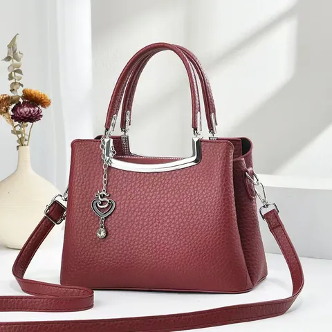Women Elegant PU Leather Handbag With Litchi Grain Heart Pendant Silver Hardware Fashion Crossbody Bag For Daily Commute