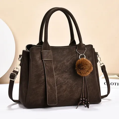 Damen Retro PU Leder Handtasche Große Kapazität Pendeln Tote Bag Mit Plüschball Anhänger Mode Umhängetasche