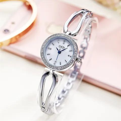 Elegante Damen Armbanduhr Edelstahl Hohlband Eingesetzte Strasssteine Perlmutt Zifferblatt Quarzuhr Silberfarben