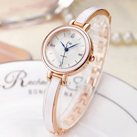Fashion Women Bracelet Quartz Watch Elegant Roman Numerals Dial Blue Hands Stainless Steel Band Alloy Case Bangle Wristwatch