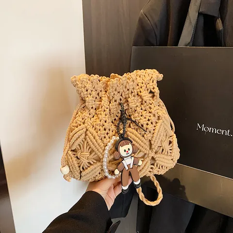 Handmade Woven Straw Bucket Bag For Women Fashion Crossbody Shoulder Bag With Pearl Cartoon Doll Pendant Beach Vacation Travel Handbag
