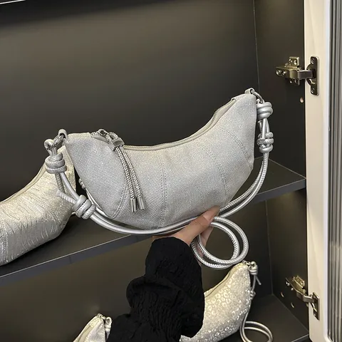 Metallic Silver Crescent Crossbody Bag For Women Wavy Texture PU Leather Shoulder Bag With Knot Strap And Tassel Fashion Dumpling Bag