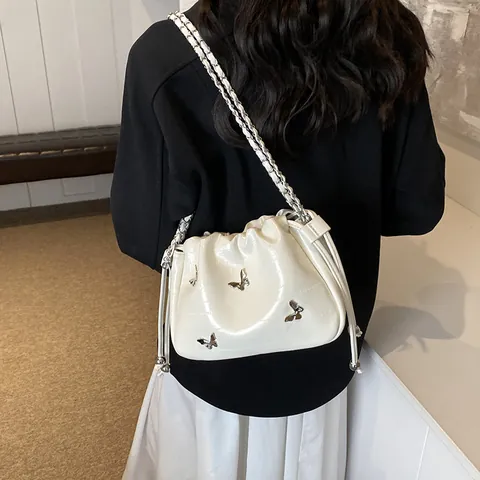 Women Fashion Butterfly Metal Decor Drawstring Bucket Bag Metallic PU Leather Chain Strap Shoulder Crossbody Bag