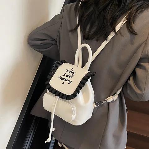 Damen Mädchen Mini PU Leder Rucksack Süß Rüschen Lotusblatt Rand Stickerei Buchstabe Today I Did Nothing Kleine Schultasche