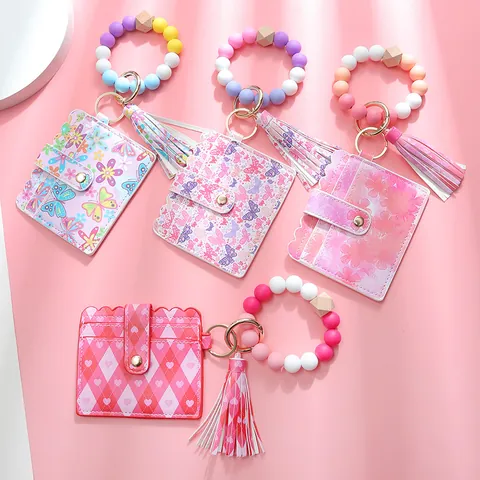 Set Portachiavi con Bracciale in Perline di Silicone e Porta Carte in Pelle PU Con Nappa Stampa Farfalla Cuore Fiore per Donna Accessori