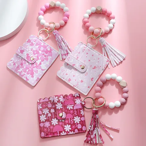 Set Portachiavi con Bracciale in Perline di Silicone e Porta Carte in Pelle PU Con Nappa Stampa Farfalla Cuore Fiore per Donna Accessori