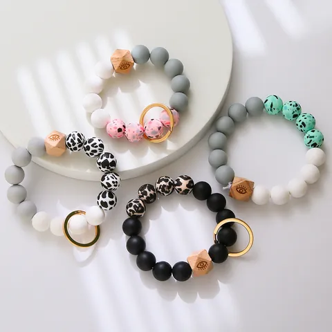 Porte-clés Bracelet en Silicone Perlé pour Femmes Bracelet Perle en Bois Mauvais Œil Anneau de Clé Avec Fermoir Mousqueton en Alliage