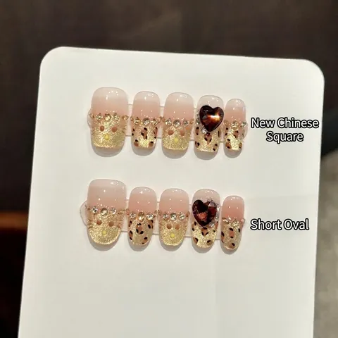 Unghie Finte da Applicare Fatte a Mano di Lusso con Stampa Leopardata e Gemma a Cuore Strass Glitter Oro per Donna